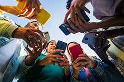 Group of people browsing websites on mobile phones